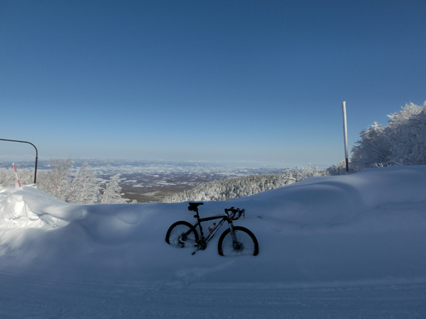 K's bike and the city of Kamifurano