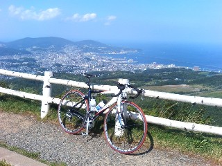 Tesseract's bike and view of Otaru from the Observatory